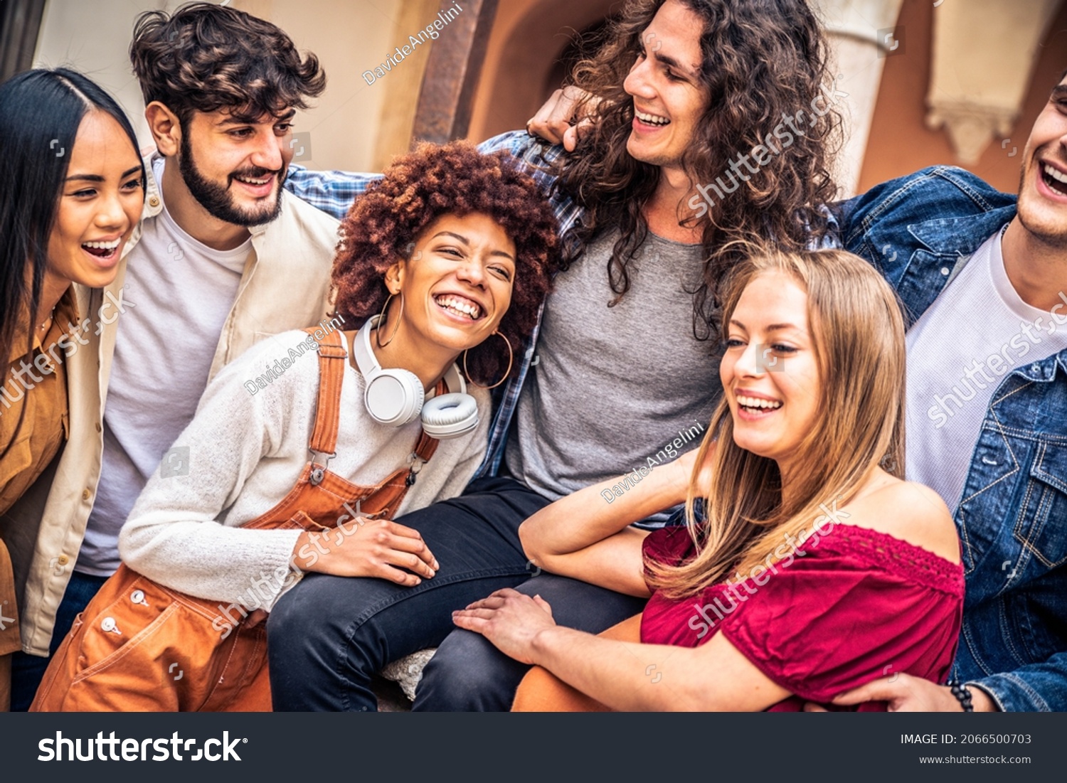 stock photo multiracial group of friends laughing together outside multi ethnic young people having fun on 2066500703